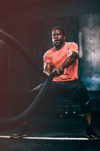 An athlete training with a cable machine in a gym