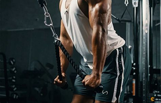 An athlete mid-set on a cable machine